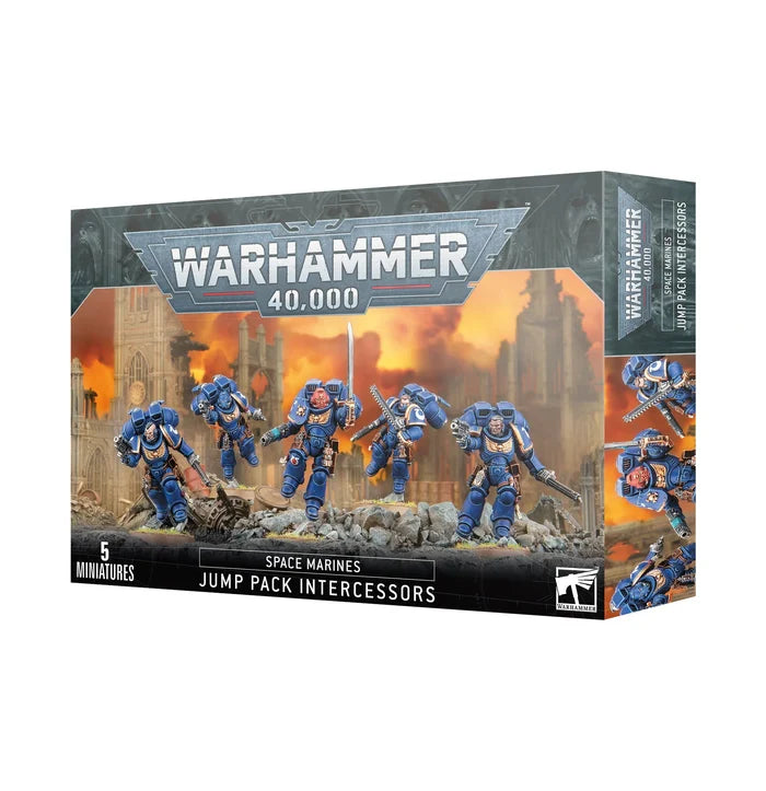 Product box featuring five blue-armored miniatures with jump packs flying over a ruined, orange-lit battlefield.