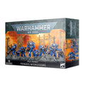 Warhammer box showing ten blue-armored miniatures on rocky terrain with a fiery orange background.