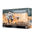 Product box for a white and red T'au Commander mech and drone miniature set against a rocky desert landscape.