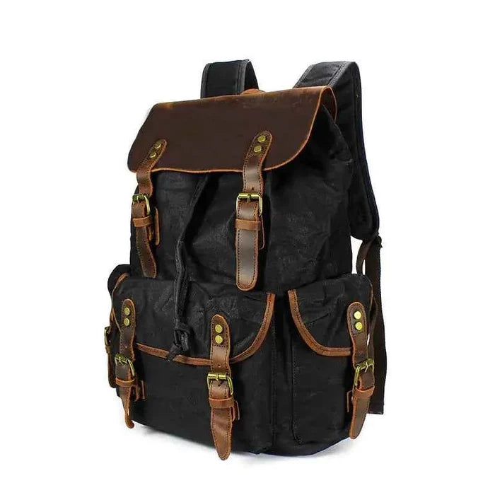 Black waxed canvas computer travel bag with leather accents, Mead's Supply & Equipment Outfitters laptop backpack for work and school.