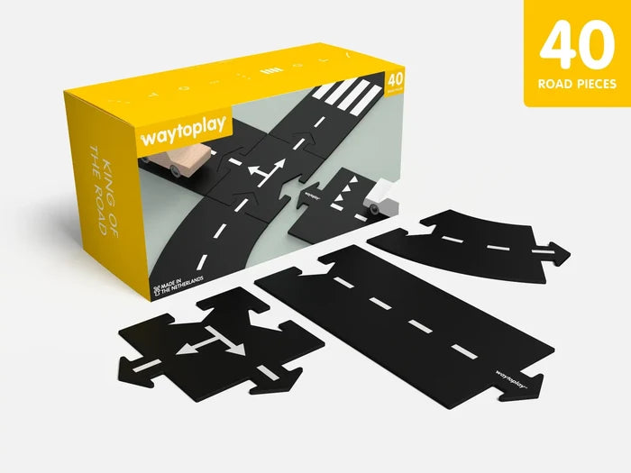 40-piece set of flexible black toy road segments with white markings shown with a yellow display box.