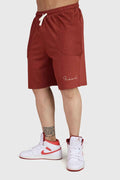 Fuaark Nz Weekend Rust oversized shorts made of soft fabric, displayed on a hanger with a relaxed fit and casual style.