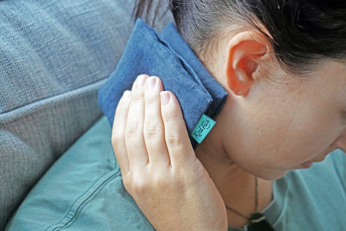 Weighted eye pillow by Do Not Disturb Sleep Company with a soft fabric cover, designed for relaxation and eye comfort.