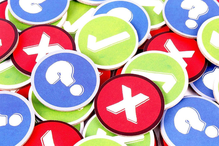 Pile of blue, green, and red circular tokens featuring white question marks, checkmarks, and X symbols.