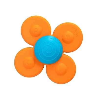 Four-petaled orange suction toy with a blue spiral center hub on a plain white background.