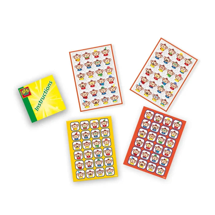 Instruction booklet and four sheets of colorful monkey stickers with different hats, glasses, and expressions.