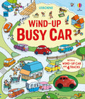 Colorful book cover with cartoon road and beach scenes, featuring a red wind-up toy car in a circular inset.