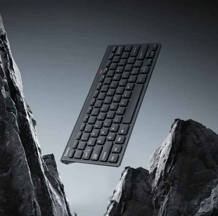 Wireless mini keyboard by TechPlus with USB nano receiver, compact design, black keys, and multimedia function keys.