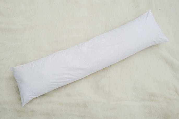 Comfortable Wisewool™ Body Pillow from Do Not Disturb Sleep Company, featuring soft fabric and ergonomic design for restful sleep.