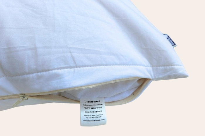 Do Not Disturb Sleep Company Wisewool™ Cloud Pillow with soft, plush fabric and cloud-like comfort for restful sleep.