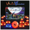 Wizards & Werewolves box with glowing orange and blue wristbands and light-up crystals on a dark background.