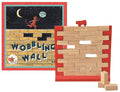 Illustrated box next to a red wooden frame filled with light wood blocks and topped with a small red cat figurine.