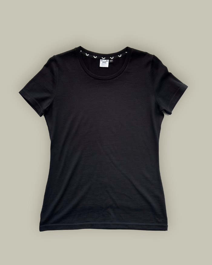 Black women's crew T-shirt made from 100% Merino Wool by Merino 365 NZ, shown on a model in a close-up shot.