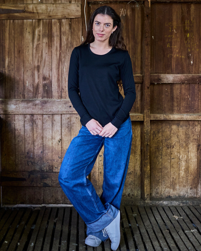 Women's black merino wool long sleeve shirt by Merino 365 NZ, made from 100% Merino wool, shown on a model.