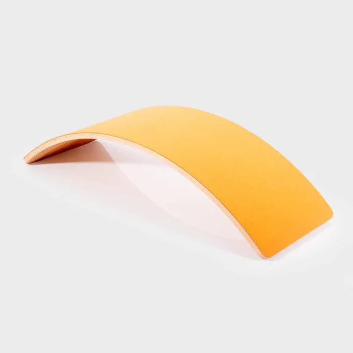 Curved wooden balance board with a bright yellow top and natural wood layered edges on a white background.