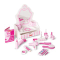 Pink and white wooden tabletop vanity with mirror, drawer, and play salon accessories like hair dryer and makeup.