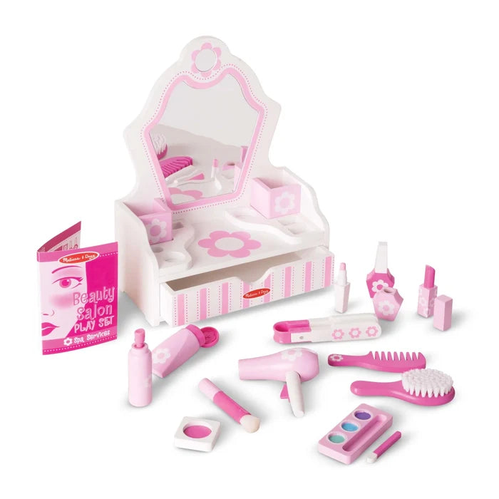 Pink and white wooden tabletop vanity with mirror, drawer, and play salon accessories like hair dryer and makeup.