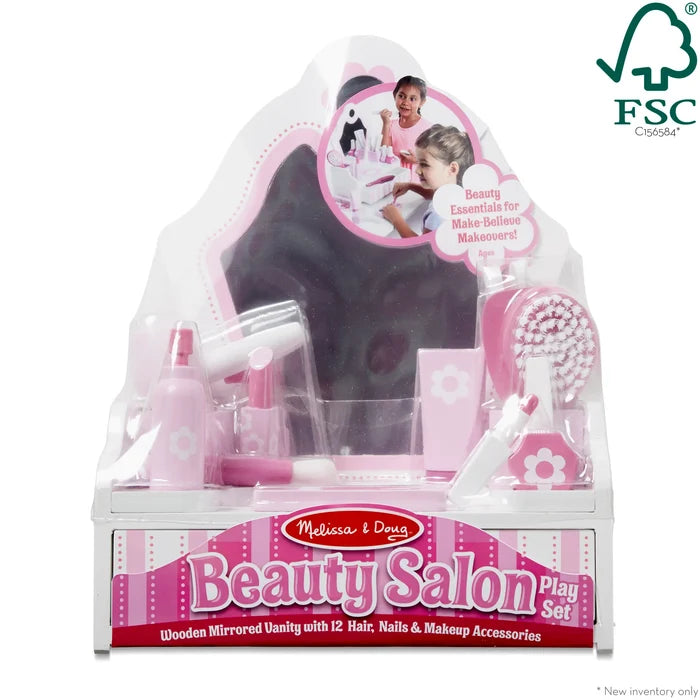 Pink and white wooden beauty salon set in packaging with a mirror and various hair, nail, and makeup accessories.