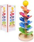 Colorful wooden marble run with rainbow petals on a central tower, pictured next to its white goki brand box.