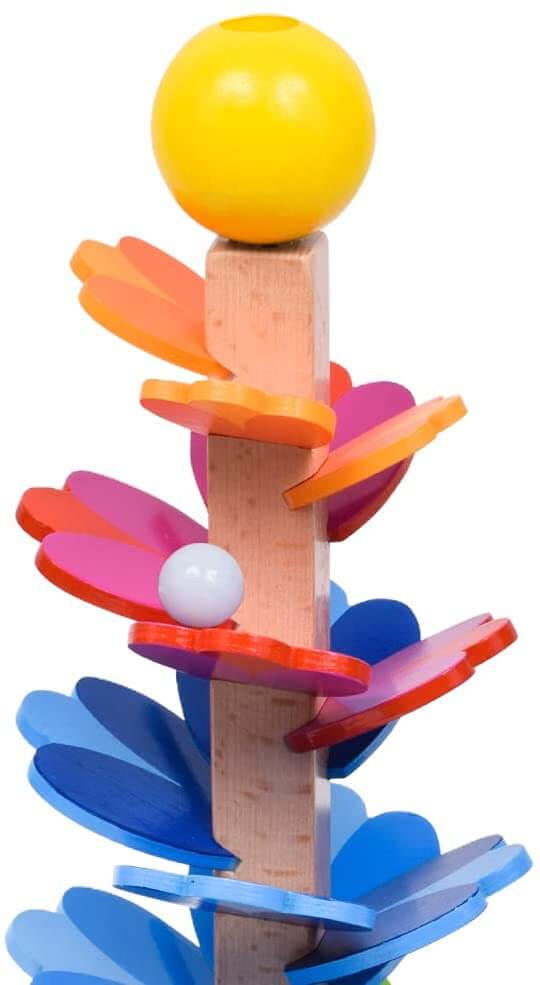 Wooden tower with orange, pink, and blue petal leaves, a large yellow top ball, and a white marble rolling down.