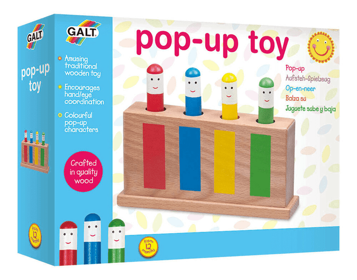 Product packaging for a wooden pop-up toy with four colorful smiley-face pegs on a wooden base.