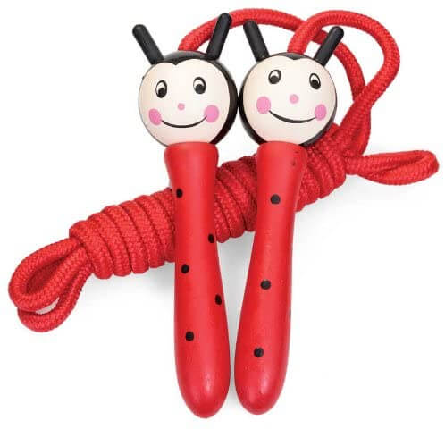 Red ladybug skipping rope with smiling wooden handles, black polka dots, and a thick red coiled rope.