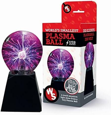Miniature plasma ball with purple electric arcs on a black base, shown next to its red and white retail packaging.