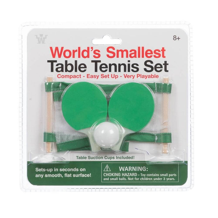 Blister pack with two miniature green paddles, a small white ball, and a green net on two wooden posts.