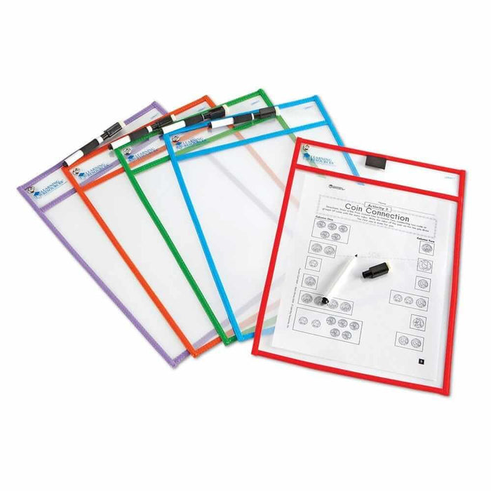 Five fanned-out clear dry-erase pockets with colorful borders and markers; the red pocket contains a math worksheet.