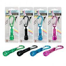 Small green, black, blue, and pink flashlights with carabiners, shown inside blister packs and laying flat.